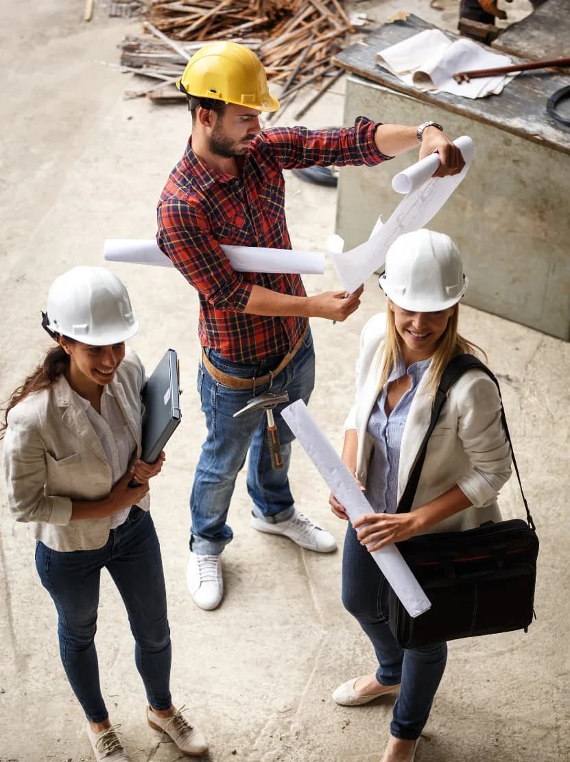 Quantum Shields team members reviewing drawings on site